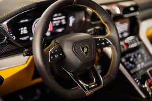 Ternopil, Ukraine- November 11, 2022: Steering wheel of yellow Lamborghini Urus.